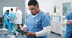 Nurse, man and typing on tablet for medical records, outpatient referral and nursing admin. Health staff, person and digital for clinical notes, pathology results or EHR for hospital discharge report