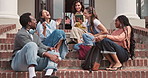 University students, talking and laughing at stairs outdoor for education break, humor or clap. College, happy people or friends on steps at campus for funny chat with academic lecturer with tablet