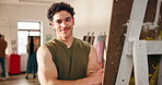 Face, confident man or artist painting on canvas with inspiration, smile or creative process. Painter, arms crossed or happy person with brush for artistic design, artwork or portrait in studio class