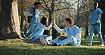 Nurse, education and high five with friends, outdoor and happy for study achievement and knowledge. Park, medical students and excited people with books, talk and celebration for research on tablet