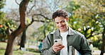 Student, man and smile at university campus with phone, text message and books for knowledge growth. Happy, person and walk outdoor at college with tech, social media or website for higher education.