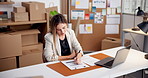 Ecommerce, woman and laptop with clipboard for writing online order info, shipping and distribution. Person, computer and delivery paperwork in small business for courier, supply chain and logistics.