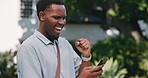 Student, winning and black man with phone on campus for college acceptance, approval or confirmation. Happy, male person and academic learner with smile or fist pump for online app or good news