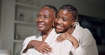Home, hug and black woman with adult daughter, smile and connection with bonding on self care day. Happy, quality time and senior mother with person for pampering, family relationship and embrace
