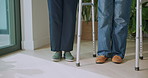 Help, cane and legs of nurse with senior woman in home for support, guide and assisted living. Retirement, walking and caregiver with elderly patient for balance, mobility and aid for movement