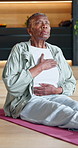 Meditation, breathing and old woman in house on yoga mat, mindfulness and inner peace for wellness. Chakra, calm and black person with holistic health for zen, fitness and stress relief in retirement