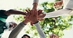 Below, students and hands together in university with motivation, friends or higher education goals. Happy, people and stack outdoor at college with celebration, encouragement or support for learning