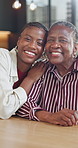 Face, care and senior mother with happy woman in home,  black family and laughing together for love. Adult daughter, elderly parent and portrait with smile, funny or support for relationship wellness