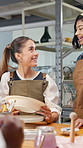 Teacher, women and discussion in art studio with ceramics, explain idea and planning painting design. Instructor, people and talk in pottery workshop with clay bowl, guidance and tips for creativity.