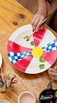 Hands, person and painting pottery in studio for art, creative decoration and handmade craft. Paintbrush, pattern and woman with ceramic in class for design inspiration, artistic process and above