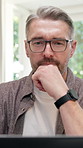 Thinking, review or man in home office with laptop, funding pitch idea or budget insight in remote work. Glasses, WFH or finance advisor with tech, portfolio check or proposal solution for investment