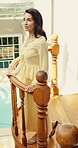 Smile, woman and balcony at resort for travel, guest arrival and checkin for summer holiday. Thinking, mature person or terrace at hotel for tourism, explore villa and destination for vacation rental