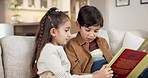 Love, reading and children on couch with book, siblings storytelling and bonding in weekend hobby. Fantasy, boy and girl in home with story, quality time and family connection in literature activity.