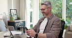 Smile, freelancer and man with phone in home office for meme post, business notification or chat app. Mobile, remote work and mature person typing for text communication, networking and funny message