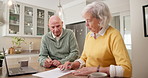 Senior, couple and finance with documents in home for asset management, insurance or budget. Elderly, man and woman with paperwork or laptop for retirement or financial planning together in house