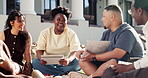 Happy, outdoor and people at college for study group, learning and talking for exam prep together. University, laugh and students with textbooks, chat and tech for education, assignment and knowledge