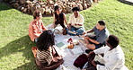 Outdoor, books and students on grass for study group, learning and talking for exam prep together. University, campus and friends with textbooks, chat and break for education, assignment and college