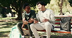 Phone, nurse and reading with students in park for medical entrance exam, result and support. Healthcare college, happy and study schedule with men outdoor for online portal and doctor trainee