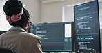 Woman, screen and code with computer for programming, script and update firewall for cybersecurity. Back, programmer and coding in office with tech, debugging system and testing for data protection