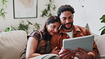 Happy, couple and watching movie on sofa with tablet, romantic show and bonding together on weekend. Cozy, married people and relax in home with tech, streaming film and app for online entertainment.