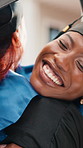 University, hug or friends at campus with graduation, happy moment or college milestone at farewell. Smile, women or student with support, celebration together or congratulations at diploma ceremony.