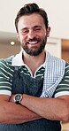 Hospitality, face and man in cafe with arms crossed, catering service and owner of dining business. Happy, portrait and restaurant entrepreneur with laugh, about us or confidence in culinary industry