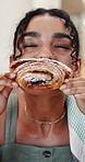 Coffee shop, woman and eating croissant for breakfast, sweet craving and bite morning food on break. Female person, hungry and pastry at cafe with delicious treat, relax and customer with dessert