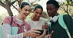 Happy, university and friends with phone for videos, funny meme and social media post outdoor. School, college and medical students on cellphone for internet, humor and joke for bonding on campus