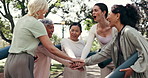 Mature, women and fitness coach with hands together in park for workout mission or motivation. Female people, active team or piling with stack for outdoor exercise, health or wellness in nature