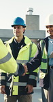Technician, handshake and meeting at construction site with engineer, introduction and collaboration. People, electrician and shaking hands outdoor with supervisor for welcome, deal and teamwork.
