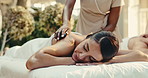 Spa, relax and woman with hot stones for back massage, muscle tension and stress relief at resort. Hospitality, person and masseuse with heat therapy for holistic healing, wellness and self care