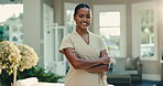 Arms crossed, woman and massage therapist with smile at spa for holistic healing, wellness or luxury. Face, happy person and salon worker, therapy service and confident professional at resort garden