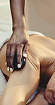 Hands, person and back massage at spa with hot stone, deep tissue and treatment for self care. Masseuse, woman and detox at salon with warm rocks, pamper session and thermal therapy for body wellness