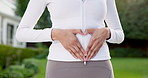 Woman, hands or stomach with heart in nature for health, abdominal wellness or healing digestion. Active, female person or belly with shape or symbol for gut detox, fitness or balance in outdoor park