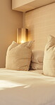 Hospitality, empty and bedroom in hotel for holiday, cozy bedsheets and luxury setup for vacation. Tidy, vacant and decor in suite with space, getaway guest room and comfortable duvet at resort.