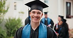 Face, man and student at campus for graduation, ceremony and learning diploma for degree completion. Portrait, male person and graduate outdoor with regalia, accolade award and education milestone