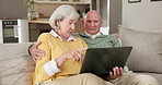 Laptop, home and senior couple with discussion for retirement benefits, annuity or 401k savings plan. Computer,  man and woman in living room for financial lump sum, pension review or old age grant