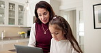 Laptop, mother and child in home for learning, help with project or bonding together for development. Computer, parent and girl in family kitchen for education, teaching and growth with daughter