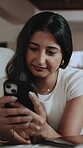 Typing, message and woman with phone in house, scroll or communication with contact on social media. Texting, home and happy person with technology, internet connection and chatting on mobile app
