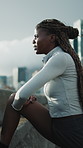 Runner, black woman and stretching legs outdoor for health, injury prevention and preparation. Female person, fitness and warm up muscle to start exercise on city bridge, circulation and wellness