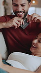 Relax, couple or laugh on sofa with credit card, event ticket sale or high five for reservation slot. Debit, people and kiss in home for general admission, concert seat and celebration for discount