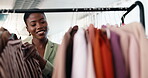 Fashion, choice or woman at clothes rack for shopping, outfit search or sale on garment collection. Happy, black person or browse rail for boutique promotion, wardrobe update or decision for purchase