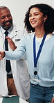 Healthcare, doctor and handshake in hospital with applause, medical achievement and onboarding. Woman, shaking hands and clinic employees with clapping for hiring, contract agreement and recognition