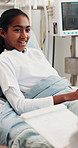 Happy, child and discussion in hospital bed with doctor, health update or advice for rehabilitation. Girl, smile and talk in medical clinic with pediatrician, recovery feedback and wellness checkup.