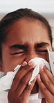 Sick, kid and tissue in hospital for blowing nose, respiratory infection and recovery from illness. Girl, child and flu symptoms in medical clinic with toilet paper, bacteria and health condition.