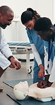 Doctor, nurses and dummy at hospital for cpr, demonstration and medical course for critical care. Nursing, people and compression in office with mannequin, rescue training and emergency resuscitation