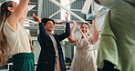 Office, women and throw paper for celebration with team, happiness or applause for business success. Excited, people and documents in air with company growth, high five or milestone achievement