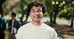 Face, park and happy man with pride for academic learning journey, travel or outdoor commute. Portrait, male person or exchange student with smile for new growth, development or foreign scholarship