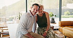 Romance, face and couple in home with hug, comfort and bonding together with loving connection. Tender, smile and mature people with security, happy moment or partner embrace in romantic relationship