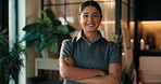 Smile, woman and massage therapist with arms crossed at spa, about us and hospitality industry. Face, happy person and worker with therapy service, confident professional and pride at luxury resort